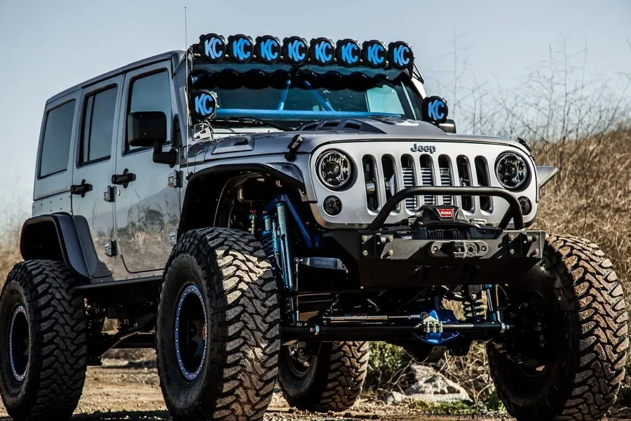 Custom off-road Jeep build with lift kit and light bar